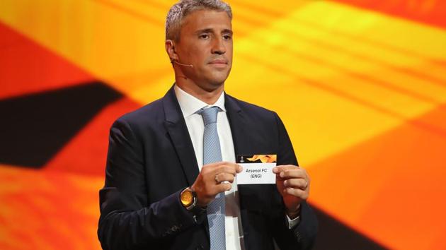 Former Argentinian footballer Hernan Crespo holds the slip of Arsenal during the draw for UEFA Europa League football tournament at The Grimaldi Forum in Monaco on August 31, 2018.(AFP)