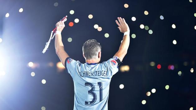 Former Bayern Munich midfielder Bastian Schweinsteiger waves prior his farewell match, between his former teams FC Bayern Munich and Chicago Fire in the stadium in Munich, southern Germany. (Christof Stache / AFP)
