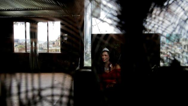 A reveller is reflected in the mirror while getting ready to take part in a LGBT pride parade to mark Gaijatra Festival, also known as the festival of cows, in Kathmandu, Nepal. (Navesh Chitrakar / REUTERS)