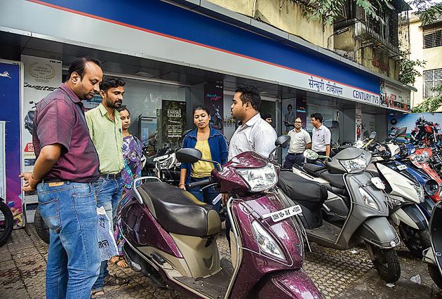 Customers will have to shell out extra money for the third party insurance, from September 1. Here, customers are looking at various options available in a showroom on Bhandarkar road on Friday. (SANKET WANKHADE/HT PHOTO) Customers will have to shell out extra money for the third party insurance, from September 1. Here, customers are looking at various options available in a showroom on Bhandarkar road on Friday. (SANKET WANKHADE/HT PHOTO)