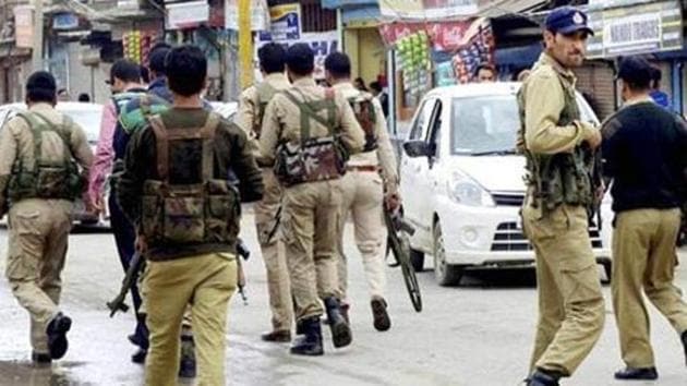 In this file photo, personnel of the Jammu and Kashmir Police search for militants who attacked a BSNL telecom franchise at Sopore.(PTI)