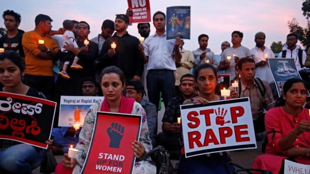 People participate in a candle light vigil as they protest against the rape of an eight-year-old girl in Kathua near Jammu, and a teenager in Unnao, Uttar Pradesh state, April 13, 2018.(Reuters File Photo)