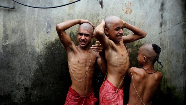 Young Hindu priests have a bath as part of a ritual during the Janai Purnima, or Sacred Thread, festival at the Pashupatinath temple in Kathmandu, Nepal. (Navesh Chitrakaar / REUTERS)