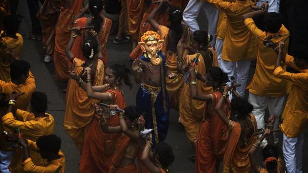 A boy dressed up as the Hindu god Ganesha participates in the Aagman procession of Tardeo Cha Raja Ganpati at Curry Road in Mumbai, Maharashtra. (Pratik Chorge / HT Photo) A boy dressed up as the Hindu god Ganesha participates in the Aagman procession of Tardeo Cha Raja Ganpati at Curry Road in Mumbai, Maharashtra. (Pratik Chorge / HT Photo)