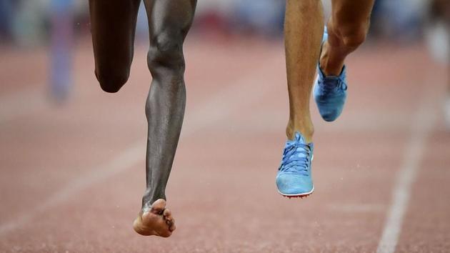 Kenya’s Conseslus Kipruto (L), who lost his shoe during the race, wins the men’s 3000 meters steeplechase, ahead of second placed Morocco’s Soufiane El Bakkali (R), during the IAAF Diamond League athletics meeting Weltklasse in Zurich, Switzerland. (Fabrice Coffrini / AFP)