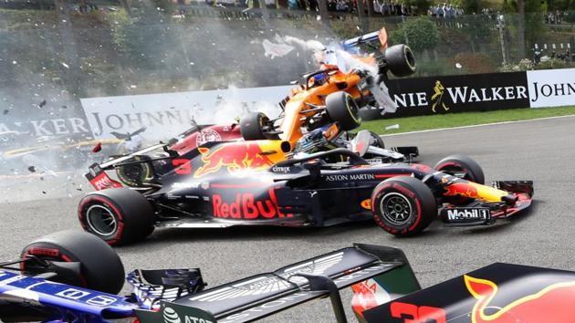 McLaren’s Spanish driver Fernando Alonso (back) crashes during the Belgian Formula One Grand Prix at the Spa-Francorchamps circuit in Spa, Belgium. (Benoit Doppagne / Belga / AFP)