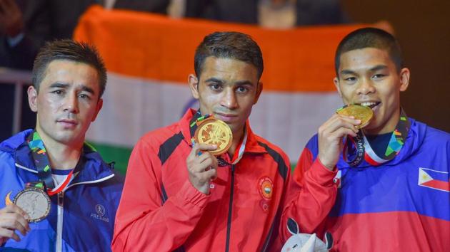 Gold-medallist India's Amit Panghal (C) during the presentation ceremony for Men's light fly (46-49kg) boxing at the 18th Asian Games 2018 (PTI) Gold-medallist India's Amit Panghal (C) during the presentation ceremony for Men's light fly (46-49kg) boxing at the 18th Asian Games 2018 (PTI)