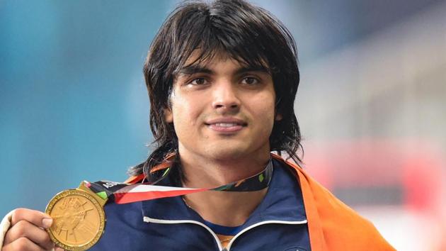 Gold medallist India's Neeraj Chopra poses for photographs at the medal ceremony of the men's javelin throw event during the 18th Asian Games 2018 in Jakarta.(PTI)