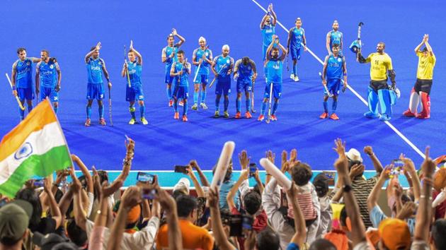 Indian men's hockey players celebrate with supporters on winning the bronze medal after defeating Pakistan 2-1. (PTI) Indian men's hockey players celebrate with supporters on winning the bronze medal after defeating Pakistan 2-1. (PTI)