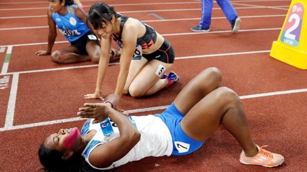 Swapna Barman of India celebrates with Yuki Yamasaki of Japan after the Women’s Heptathlon 800m event during the 2018 Asian Games in Jakarta, Indonesia. (Issei Kato / REUTERS) Swapna Barman of India celebrates with Yuki Yamasaki of Japan after the Women’s Heptathlon 800m event during the 2018 Asian Games in Jakarta, Indonesia. (Issei Kato / REUTERS)