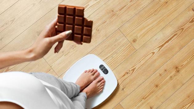 Dark chocolate is a good source of magnesium which can help you deal with moods swings, and make you feel happy by regulating serotonin levels. (Shutterstock) Dark chocolate is a good source of magnesium which can help you deal with moods swings, and make you feel happy by regulating serotonin levels. (Shutterstock)