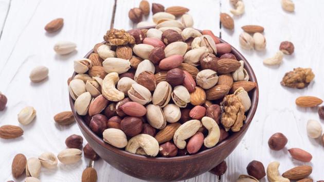 Whether it is peanuts or walnuts, nuts are a good source of magnesium and vitamins. Magnesium regulates serotonin, the feel-good chemical in your brain and reduced bloating. Walnuts are also a good source of Omega 3 fatty acids. (Shutterstock) Whether it is peanuts or walnuts, nuts are a good source of magnesium and vitamins. Magnesium regulates serotonin, the feel-good chemical in your brain and reduced bloating. Walnuts are also a good source of Omega 3 fatty acids. (Shutterstock)