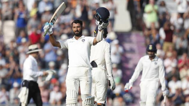 India's Cheteshwar Pujara celebrates after reaching his century on Day 2 of the fourth Test against England. (AP)
