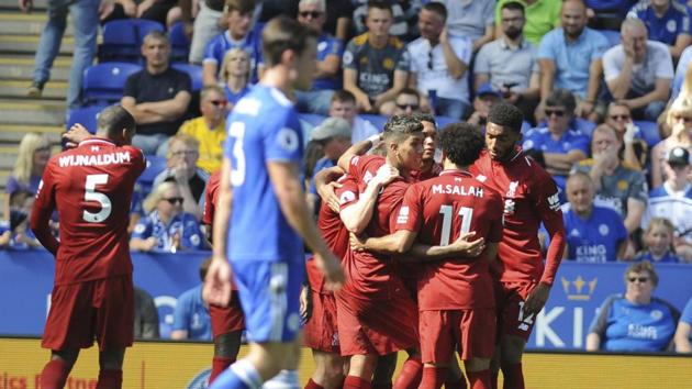 Liverpool's Roberto Firmino, centre, celebrates scoring his sides' second goal during the English Premier League soccer match between Leicester City and Liverpool at the King Power Stadium. (AP) Liverpool's Roberto Firmino, centre, celebrates scoring his sides' second goal during the English Premier League soccer match between Leicester City and Liverpool at the King Power Stadium. (AP)