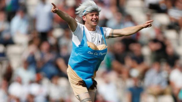 Spectator runs onto the pitch during the play. (REUTERS)