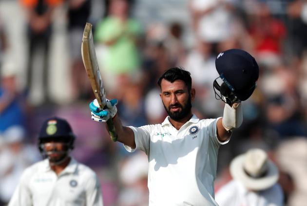 India's Cheteshwar Pujara celebrates after reaching his century. (REUTERS)