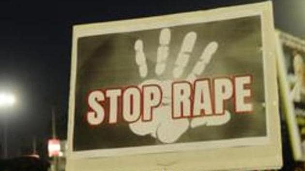 A protester holds up a placard against anti-women crimes in Kolkata. (HT File) A protester holds up a placard against anti-women crimes in Kolkata. (HT File)