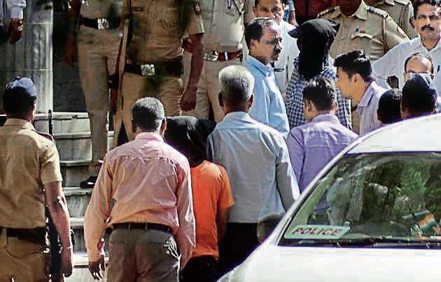 Amit Degvekar and Rajesh Bangera (in black hood), arrested in connection with journalist Gauri Lankesh’s murder produced at the Pune district court on Saturday. (Ravindra Joshi/HT PHOTO) Amit Degvekar and Rajesh Bangera (in black hood), arrested in connection with journalist Gauri Lankesh’s murder produced at the Pune district court on Saturday. (Ravindra Joshi/HT PHOTO)