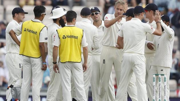England's Stuart Broad, centre, celebrates with teammates after taking the wicket of India's KL Rahul. (AP)