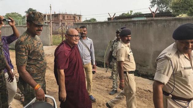 55-year-old monk Bhante Sangh Priya, a Bangladeshi national, is escorted by police after being arrested in Bodh Gaya, in Bhiar on Thursday.(AP Photo)