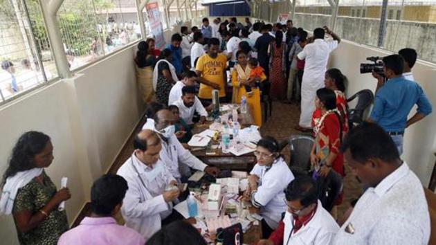 Doctors monitor the health of flood victims inside SDVP school classroom converted into a temporary relief camp, in Alleppey on Sunday, Aug 26, 2018.(PTI File Photo)