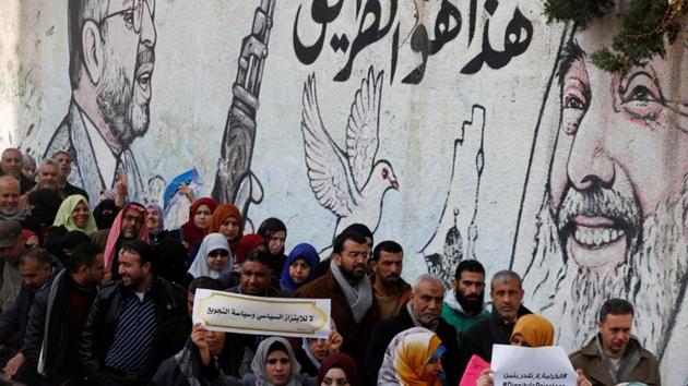 A Palestinian employee of United Nations Relief and Works Agency (UNRWA) holds a sign that reads, " no for political blackmail and starvation policy" during a protest against a US decision to cut aid, in Gaza City January 29, 2018. (REUTERS File Photo) A Palestinian employee of United Nations Relief and Works Agency (UNRWA) holds a sign that reads, " no for political blackmail and starvation policy" during a protest against a US decision to cut aid, in Gaza City January 29, 2018. (REUTERS File Photo)