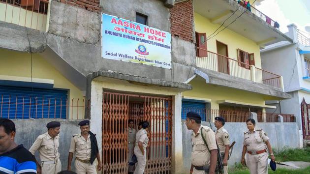 Patna: Police personnel investigate the site of Aasra Shelter Home after the death of two women inmates under mysterious circumstances. (PTI File Photo) Patna: Police personnel investigate the site of Aasra Shelter Home after the death of two women inmates under mysterious circumstances. (PTI File Photo)