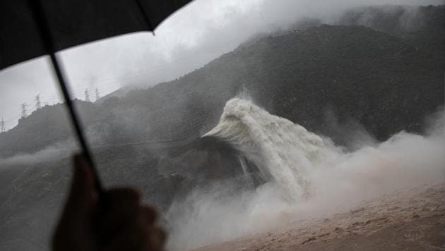 Water is released as heavy rain falls at Pubugou Dam on the Dadu river, a tributary of the Yangtze in Sichuan province, China. Authorities demolished seven small dam projects this year in the province to clear illegal developments in a new nature reserve, part of a nationwide programme to close hundreds of tiny and often ramshackle dams and turbines and bring order to China’s massive hydropower sector. (Damir Sagolj / REUTERS)