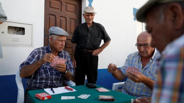 Old men play cards on a street in Amieira, Portugal. The 5 billion euro ($5.8 billion) irrigation project on the River Guadiana, begun two decades ago to revive a region at risk of desertification, is only now reaching its initial design capacity and there are plans to expand it further. It has also boosted income and jobs in the most disadvantaged region of Western Europe’s poorest country. (Rafael Marchante / REUTERS) Old men play cards on a street in Amieira, Portugal. The 5 billion euro ($5.8 billion) irrigation project on the River Guadiana, begun two decades ago to revive a region at risk of desertification, is only now reaching its initial design capacity and there are plans to expand it further. It has also boosted income and jobs in the most disadvantaged region of Western Europe’s poorest country. (Rafael Marchante / REUTERS)