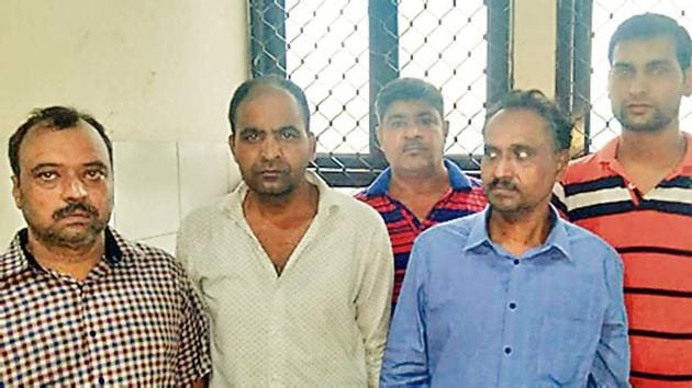 Virender Singh Rana (L), Aditya Gupta (second from left) and Samuel Kutty (second from right) in police custody (HT PHOTO) Virender Singh Rana (L), Aditya Gupta (second from left) and Samuel Kutty (second from right) in police custody (HT PHOTO)