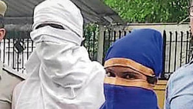 The accused, Dolly Choudhary (in blue) and Manish Choudhary (in white) after their arrest. (HT PHOTO) The accused, Dolly Choudhary (in blue) and Manish Choudhary (in white) after their arrest. (HT PHOTO)