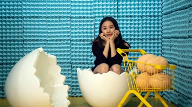 A visitor poses for a photograph at The Egg House in Shanghai. (AFP) A visitor poses for a photograph at The Egg House in Shanghai. (AFP)