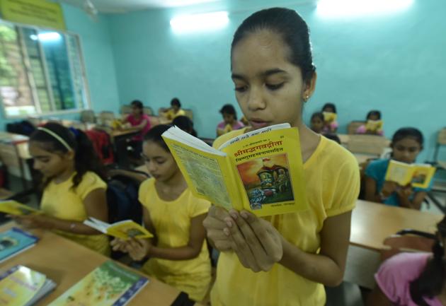 Students of Government Girls Sanskrit School, Bhopal reading Bhagwat Gita. (Photo by Mujeeb Faruqui/Hindustan Times)(Mujeeb Faruqui/HT Photo)