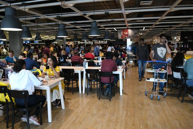 Customers eats at a restaurant at the new IKEA store in Hyderabad.(AFP Photo)