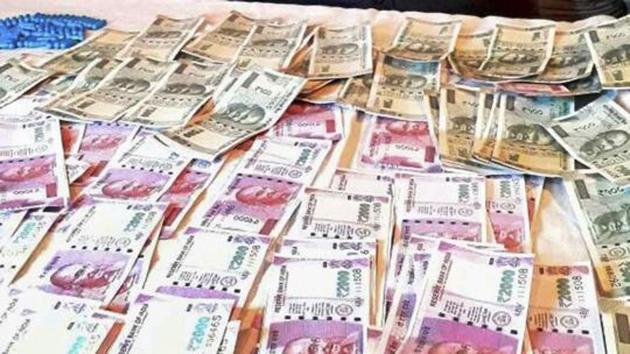 Police displays fake currency notes in denominations of Rs 2000 and Rs 500. (PTI File Photo) Police displays fake currency notes in denominations of Rs 2000 and Rs 500. (PTI File Photo)