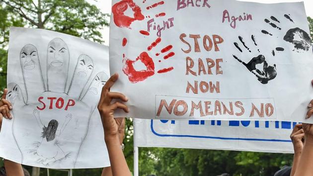 Activists display placards at Jantar Mantar in New Delhi.(PTI Photo)