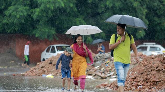 People use umbrellas to protect themselves from rain at IIT, in New Delhi on September 01, 2018. The national capital woke up to a pleasant Sunday morning after light rains lashed several parts of the city with the minimum temperature settling at 26 degrees Celsius, a notch above the season’s average. (Amal KS /HT PHOTO) People use umbrellas to protect themselves from rain at IIT, in New Delhi on September 01, 2018. The national capital woke up to a pleasant Sunday morning after light rains lashed several parts of the city with the minimum temperature settling at 26 degrees Celsius, a notch above the season’s average. (Amal KS /HT PHOTO)