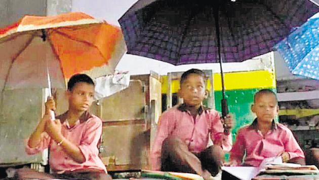 Students of the government school in Uttar Pradesh’s Banki block say that the ceiling of their classroom leaks every time it rains.(HT Photo)