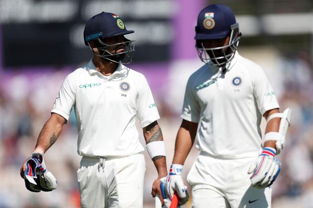 Cricket - India's Virat Kohli and Ajinkya Rahane leave the field during the fourth Test against England.(REUTERS)