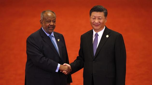 Djibouti's President Ismail Omar Guelleh, left, shakes hands with Chinese President Xi Jinping as they pose for photographs during the Forum on China-Africa Cooperation held at the Great Hall of the People in Beijing on September 3. (AP Photo) Djibouti's President Ismail Omar Guelleh, left, shakes hands with Chinese President Xi Jinping as they pose for photographs during the Forum on China-Africa Cooperation held at the Great Hall of the People in Beijing on September 3. (AP Photo)