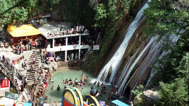 At least 180 tourists were evacuated from Mussoorie’s famous Kemty Falls after heavy rains resulted in flood-like situation on Sunday evening. Water from the 40-feet fall spilled on to the main road after debris from landslides accumulated at its origin. The flooding of the road forced tourists to take cover by climbing the hills. Water even surged into shops in the area. (S. Burmaula / HT Archive) At least 180 tourists were evacuated from Mussoorie’s famous Kemty Falls after heavy rains resulted in flood-like situation on Sunday evening. Water from the 40-feet fall spilled on to the main road after debris from landslides accumulated at its origin. The flooding of the road forced tourists to take cover by climbing the hills. Water even surged into shops in the area. (S. Burmaula / HT Archive)