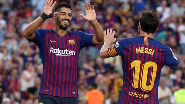 Soccer Football - La Liga Santander - FC Barcelona v SD Huesca - Camp Nou, Barcelona, Spain - September 2, 2018 Barcelona's Lionel Messi celebrates scoring their sixth goal with Luis Suarez(REUTERS)