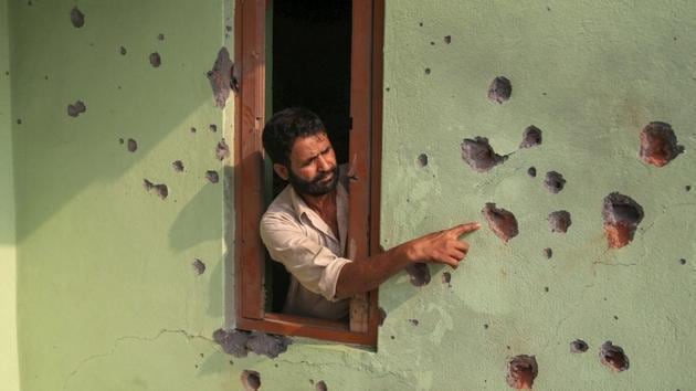 A villager shows the damaged wall of his house after shelling from the Pakistani side of the border, in the Pargwal sector of Akhnoor, about 50 km from Jammu in June 2018. (PTI Photo) A villager shows the damaged wall of his house after shelling from the Pakistani side of the border, in the Pargwal sector of Akhnoor, about 50 km from Jammu in June 2018. (PTI Photo)