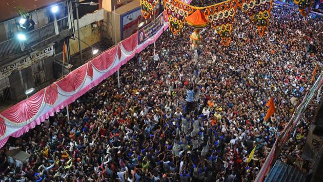 Govinda squads forming a human pyramid during the Dahi Handi celebrations at Suvarnayug Tarun Mandal, Shivaji road, on Monday. (Pratham Gokhale/HT Photo)