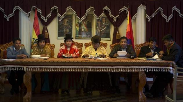Batallas Councilwoman Lidia Maria Quispe (from second left), Council Vice President Sonia Alanoca Tito and Council President Rosa Condori Cadena, attend a council meeting in Batallas. Bolivia began addressing gender imbalance in politics in 1997 with a law that at least 30% of candidates for many races be women. A decade ago, women held only 4% of posts in municipal assemblies but by 2015, they held 50%. (Juan Karita / AP) Batallas Councilwoman Lidia Maria Quispe (from second left), Council Vice President Sonia Alanoca Tito and Council President Rosa Condori Cadena, attend a council meeting in Batallas. Bolivia began addressing gender imbalance in politics in 1997 with a law that at least 30% of candidates for many races be women. A decade ago, women held only 4% of posts in municipal assemblies but by 2015, they held 50%. (Juan Karita / AP)