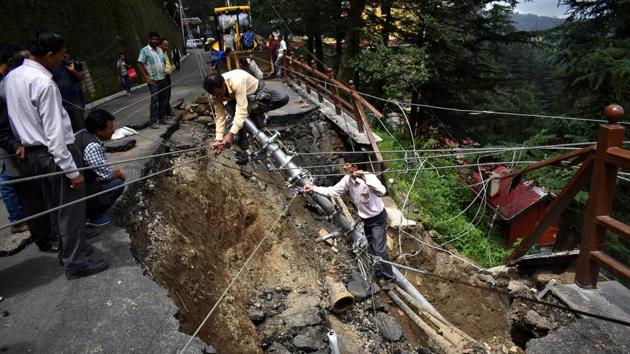Traffic was hit on the Shimla-Kalka highway after heavy rains in the past 12 hours triggered landslides on Tuesday. The road stretch connecting Tuttikandi to Dhalli was damaged due to a landslide. Shimla was lashed by heavy rain, which resulted in flooding of nullahs near Shanan close to Dhalli resulting road blocked because of debris that flowed along. (Deepak Sansta / HT File) 