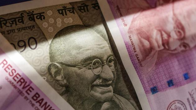 Two thousand and five hundred rupee banknotes are arranged for a photograph in Mumbai. (Bloomberg) Two thousand and five hundred rupee banknotes are arranged for a photograph in Mumbai. (Bloomberg)