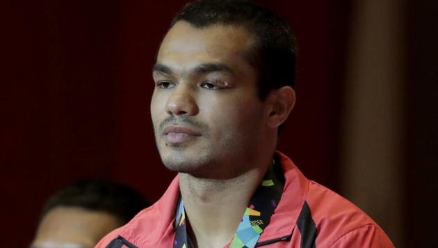 Men's middleweight boxing bronze medalist's India's Krishan Vikas stands on the podium at the 18th Asian Games in Jakarta, Indonesia, Saturday, Sept. 1, 2018.(AP)