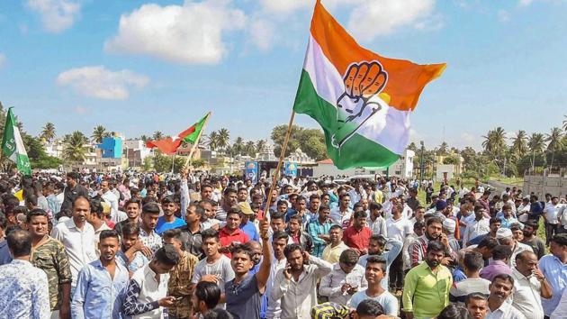 Congress party workers celebrate their win in Karnataka Urban Local Body Election 2018, in Mysuru on Wednesday.(PTI Photo)