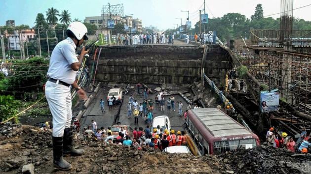 Rescue workers remove debris of the collapsed Majerhat bridge, in Kolkata.(PTI File Photo)